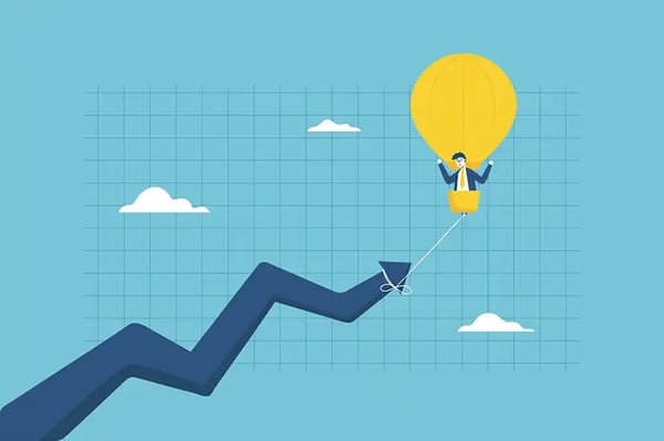 financial growth chart with image of a man with balloon at top