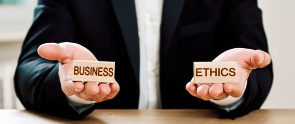 hands holding the words: business ethics