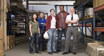 group of smiling warehouse workers