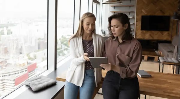 two women mentoring about company culture