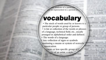 magnifying glass hovering over definition of: vocabulary